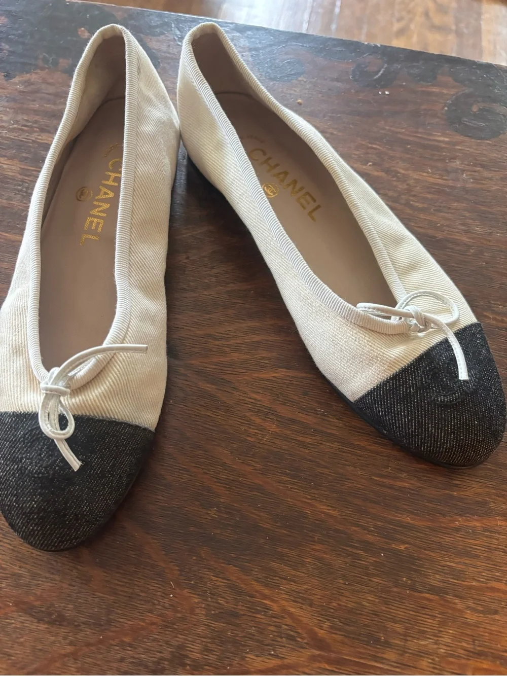CHANEL Ivory Canvas Ballet Flats with Black Cap Toe and Bow